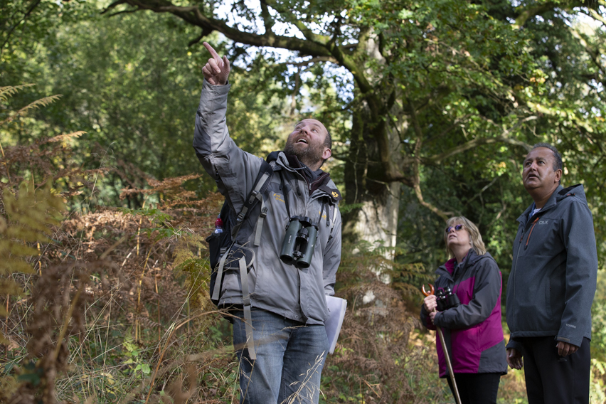 Ed Drewitt pointing out wildlife to guests
